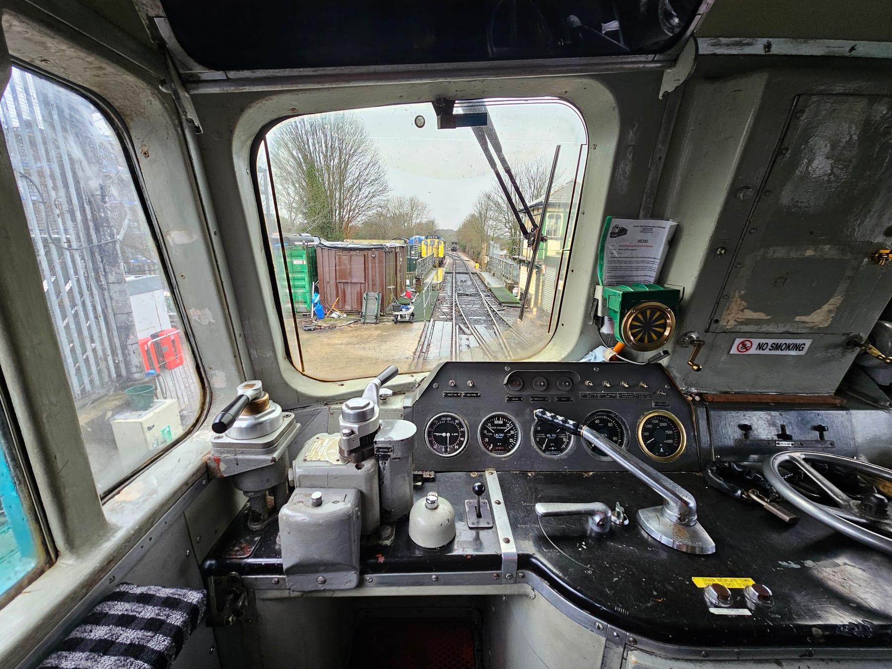 The driving desk and forward view from the cab of 33063 at the Spa Valley Railway