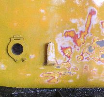 rubbing down reveals the red paint applied when stored inside the garage of Blue Triangle Buses, Rainham in the late 90's. TWW shed, 2/4/05